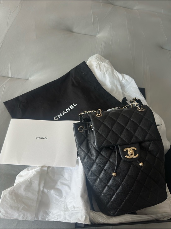 CHANEL Handbags - CHANEL Black Quilted Leather Drawstring Backpack with Gold CC